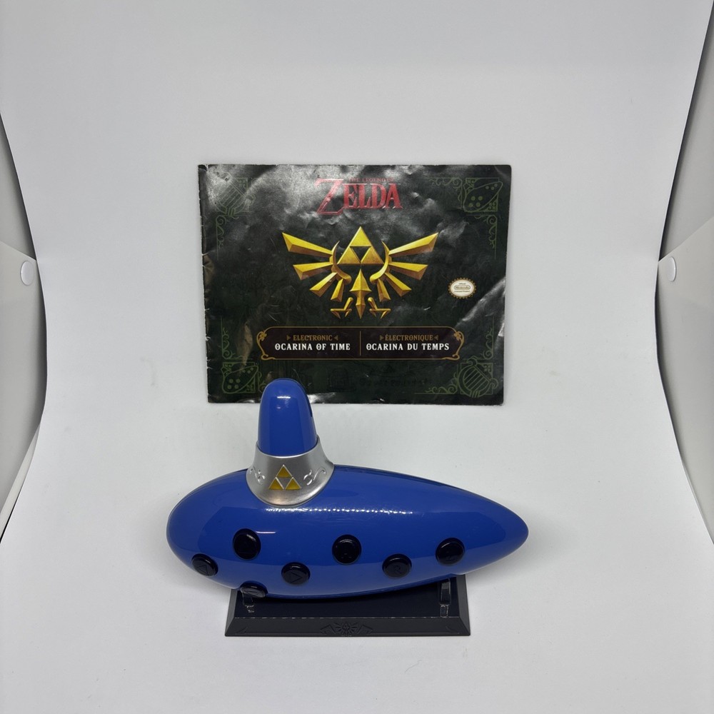 THINKGEEK Legend Of Zelda: Ocarina Of Time Electronic Ocarina W/ Stand & Book