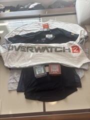 Blizzard Six Piece Bundle Including Four Shirts In Various Sizes And Two Pins