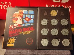 Thinkgeek Nintendo Super Mario Bros Coins – Complete 10 Coin Set & Book